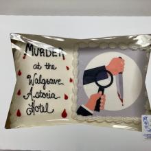 Cake reading Murder at the Walgrave Astoria Hotel