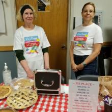 Friends serving pie